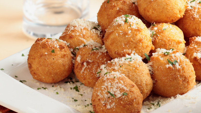 Fried cheese balls topped with parmesan and herbs