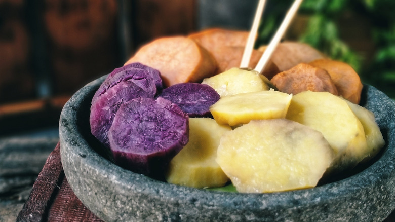 Three colors steamed sweet potato on stone plate