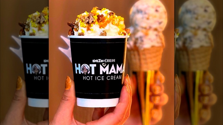 A woman holds a cup of Smize & Dream Hot Mama hot ice cream