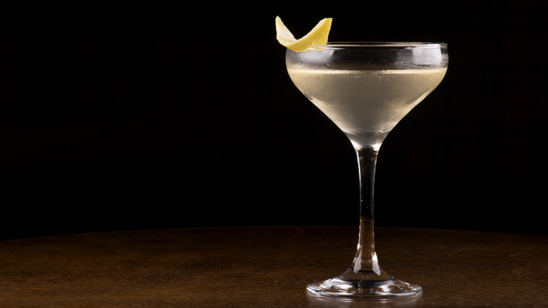 Glass of Cocktail with orange peel garnish close-up