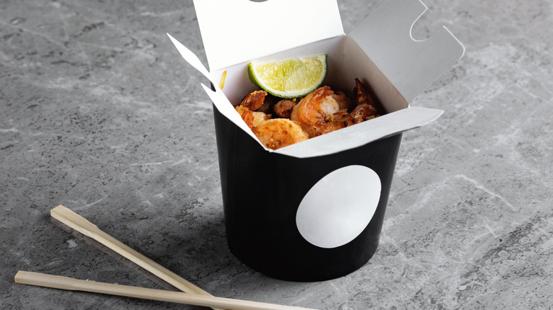Chinese takeout box with chopsticks