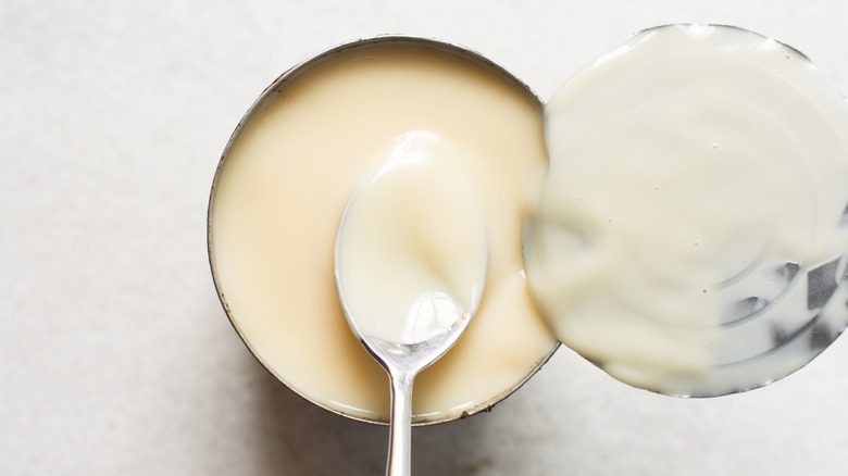 overhead of opened can of sweetened condensed milk can