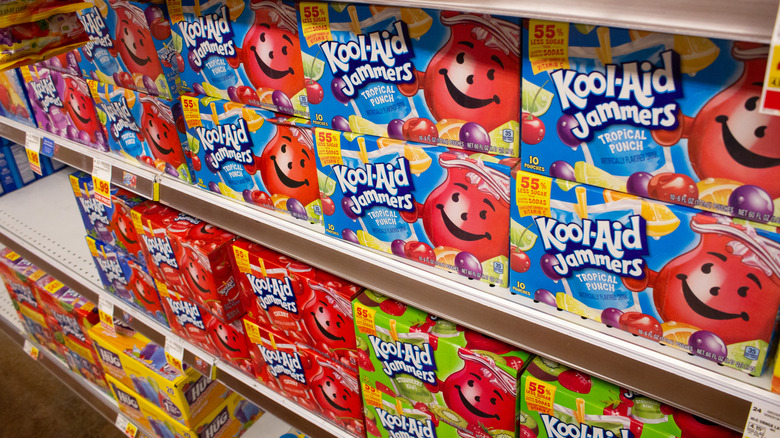Boxes of Kool-Aid Jammers juice pouches on grocery store shelf
