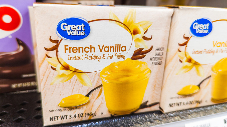 Packages of vanilla pudding mix on a grocery store shelf