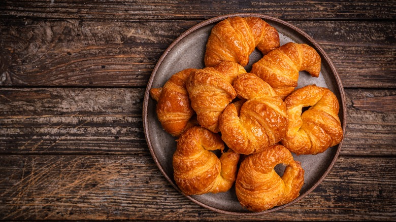 Croissants on plate on wood table