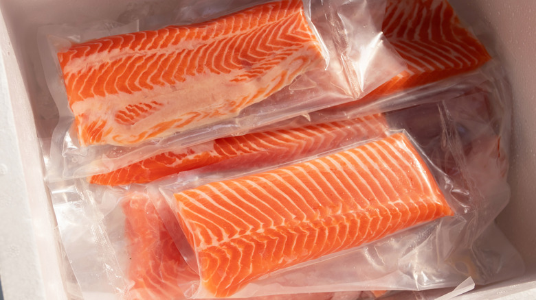 A stack of vacuum-sealed fish filets