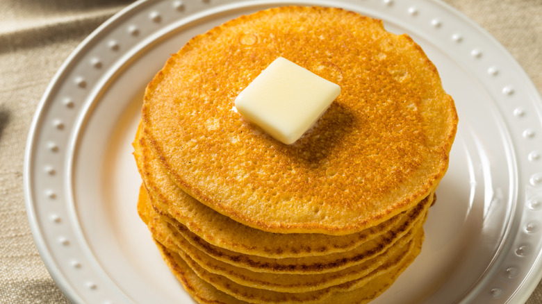 Johnnycakes with butter on a white vintage plate