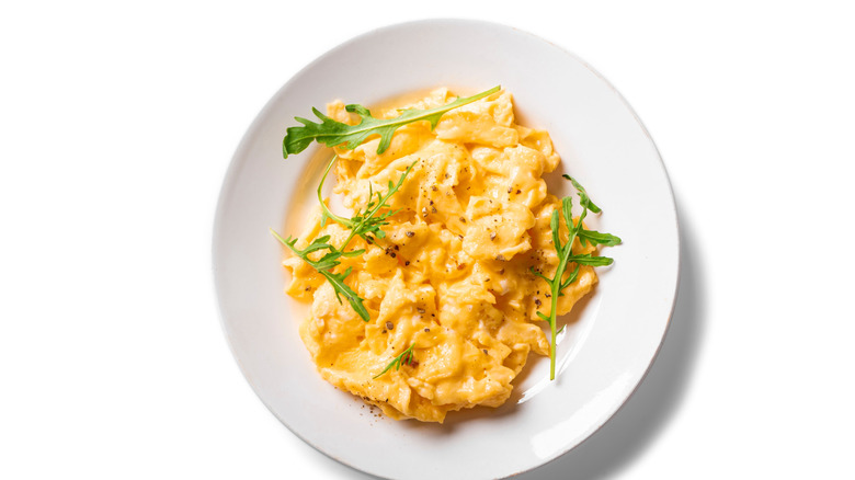 Scrambled eggs on a white plate