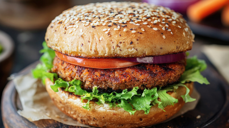 Close up of veggie burger on wheat bun.