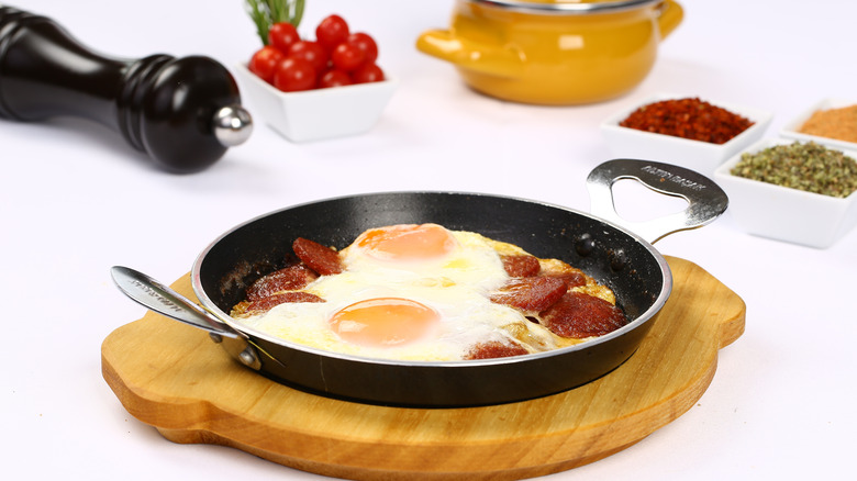 Eggs and bologna in pan
