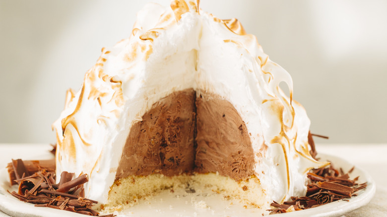 Baked Alaska with slice taken out on plate