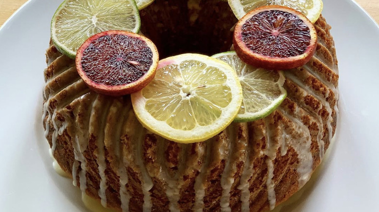 Whole Harvey Wallbanger cake topped with sliced fruit