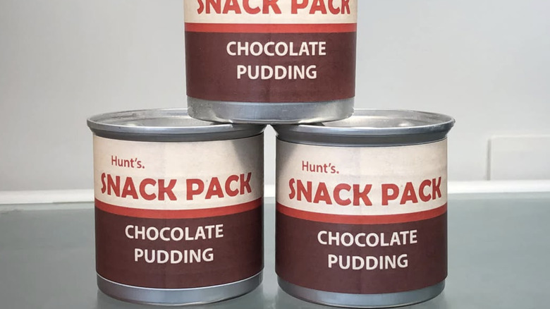 Stacks of Snack Pack pudding in metal cans
