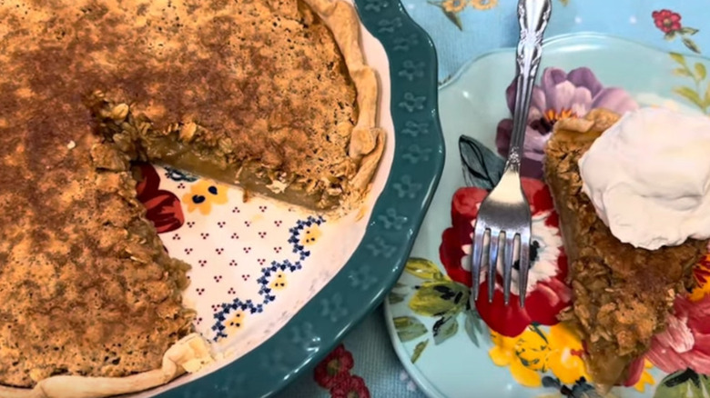 Slice of Oatmeal Pie on Plate Beside Cut Whole Pie on Platter