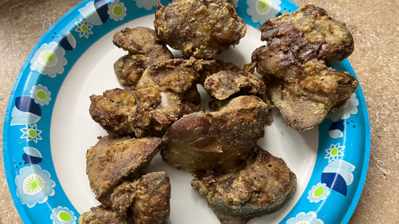 Fried chicken livers on a paper plate