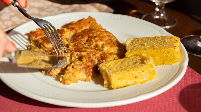 Fried cornmeal mush on a white plate