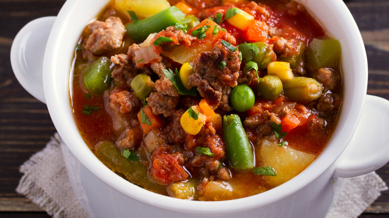 Hamburger soup in a white bowl