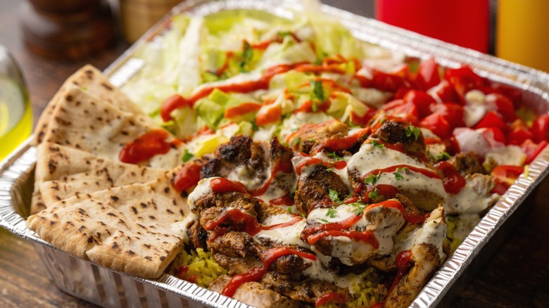 A Halal dish of chicken over rice.