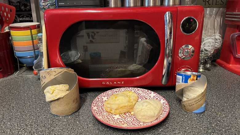 Microwaved biscuits in front of the microwave