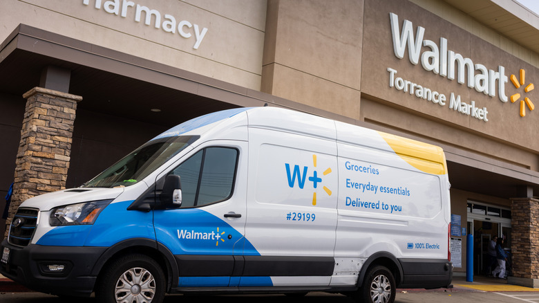 A Walmart delivery truck parked in front of a Walmart location