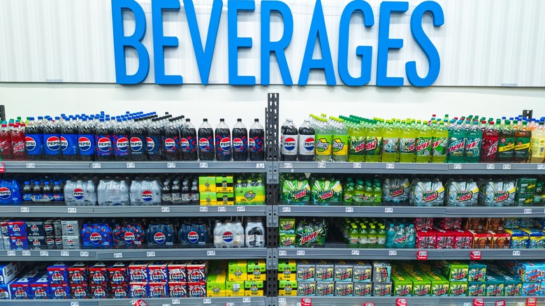 Various Pepsi products on shelf at Walmart in the beverages section
