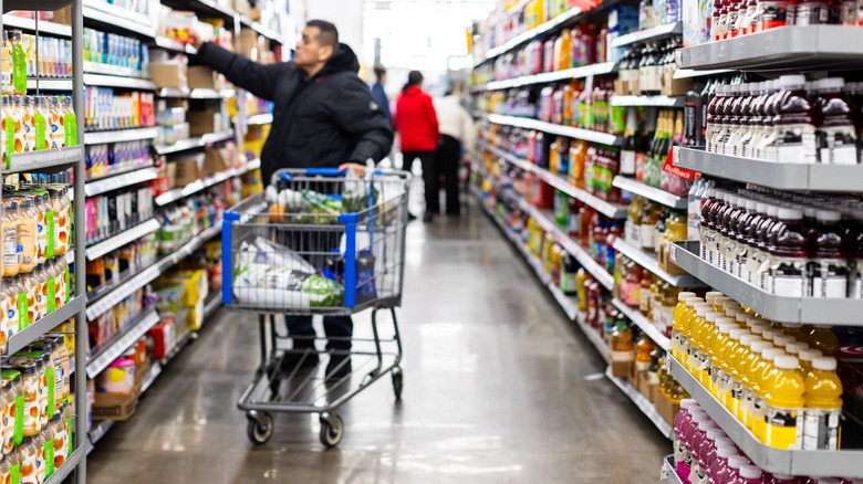 man picking out groceries in Walmart
