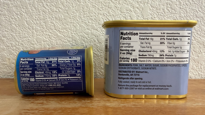 Spam can and Great Value Luncheon Meat can on a table with nutritional facts facing the camera