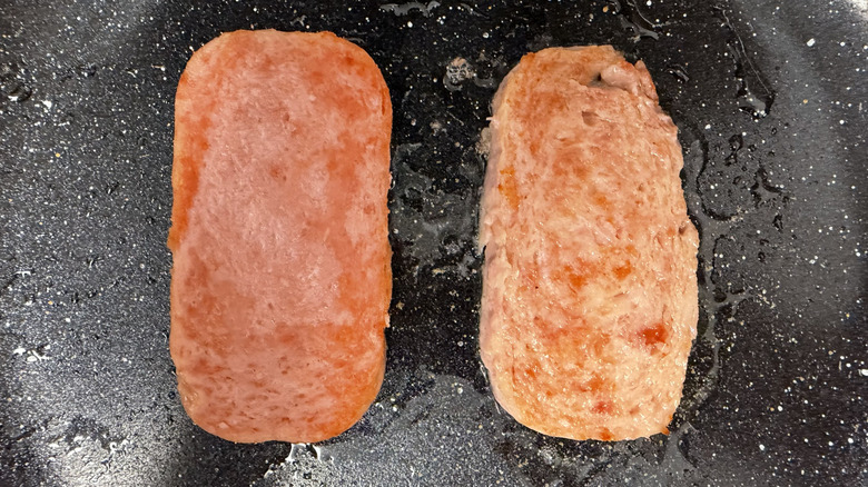 Spam slice and Great Value Luncheon Meat slice cooking in frying pan