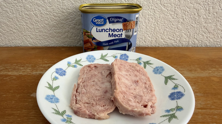 two slices of Great Value Luncheon Meat on a plate with the can in the background