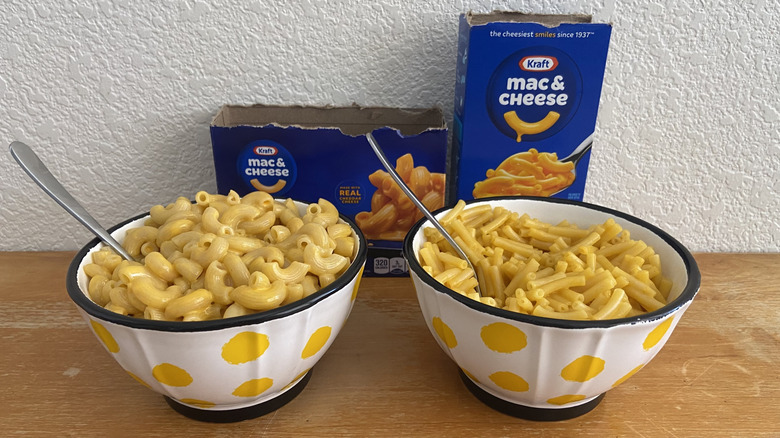 both Kraft mac & cheeses in bowls beside their boxes