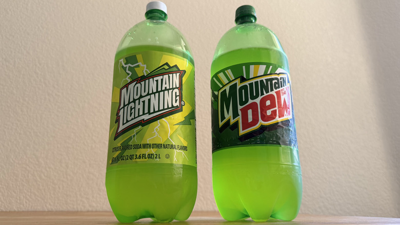 low-angle view of both soda bottles