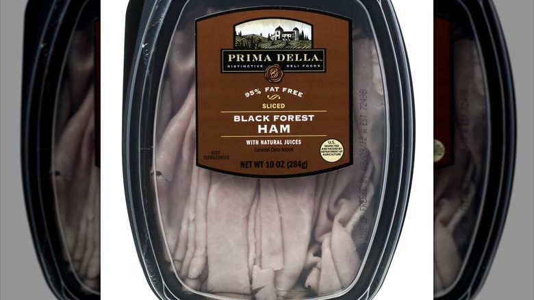 Package of Prima Della ham, white background, mirrored