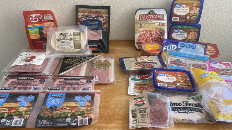 each store's deli meats on a table slightly separated