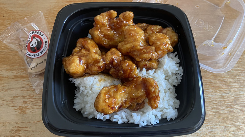 Panda Express orange chicken bowl with the lid off