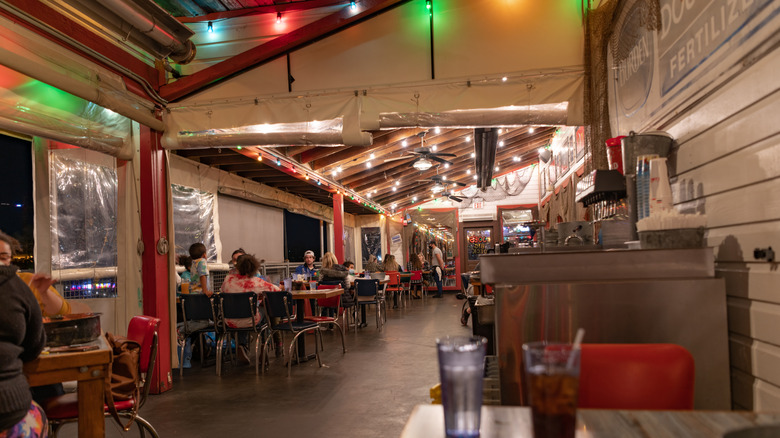 Customers dine at tables inside Joe's Crab Shack in Sacramento, California