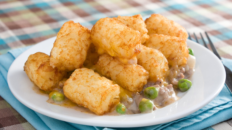 Cowboy casserole made with peas, ground beef, and tater tots