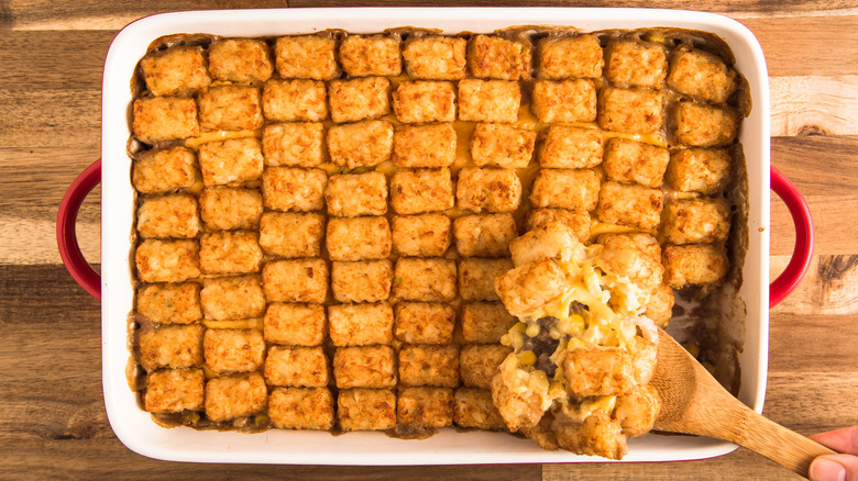 Cowboy Casserole with tater tots, corn, cheese, and ground beef,
