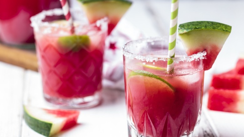 Two watermelon cocktails on white background.