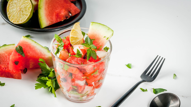 Watermelon pico de gallo in a glass with a fork on the side