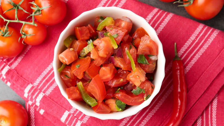 Bowl of pico de gallo over a red cloth