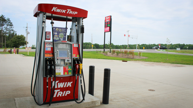 A Kwik Trip gas pump near the road