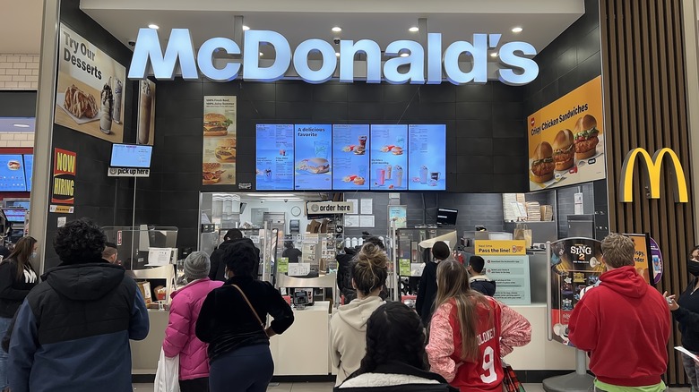 People waiting to get food at McDonald's