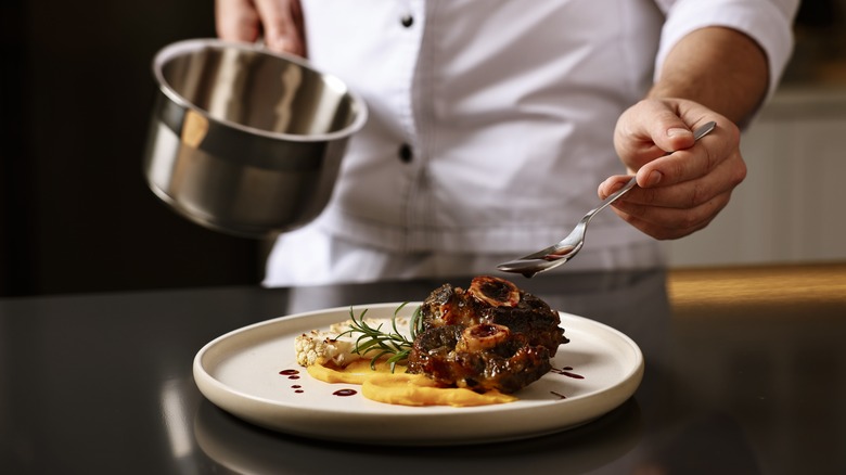 chef preparing some type of haute cuisine