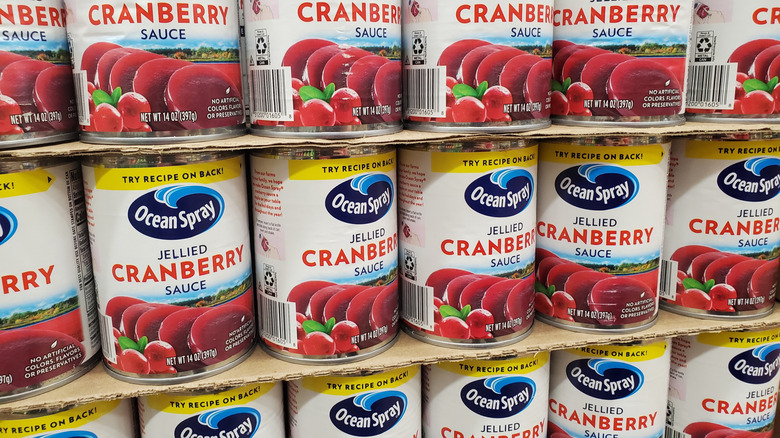 Three rows of Ocean Spray jellied cranberry sauce on a store shelf