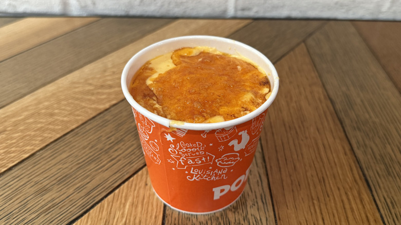A Popeyes cup filled with Homestyle Mac & Cheese