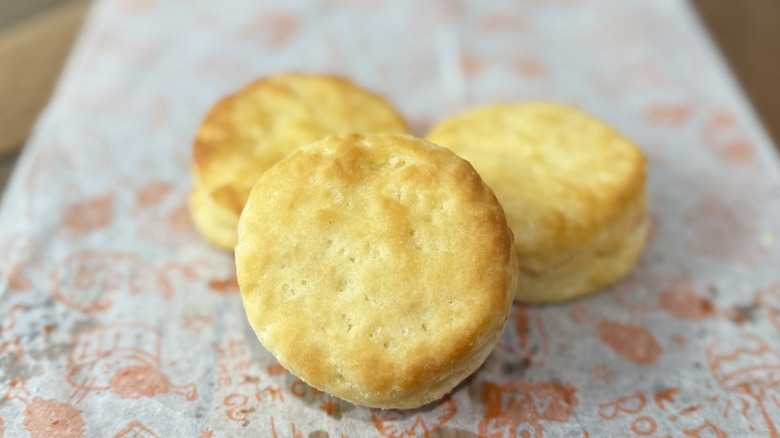 Three biscuits on a Popeyes wrapper