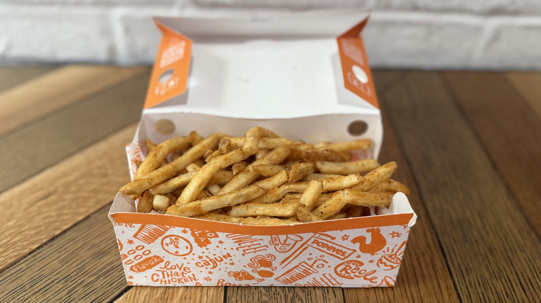 A box filled with Cajun Fries