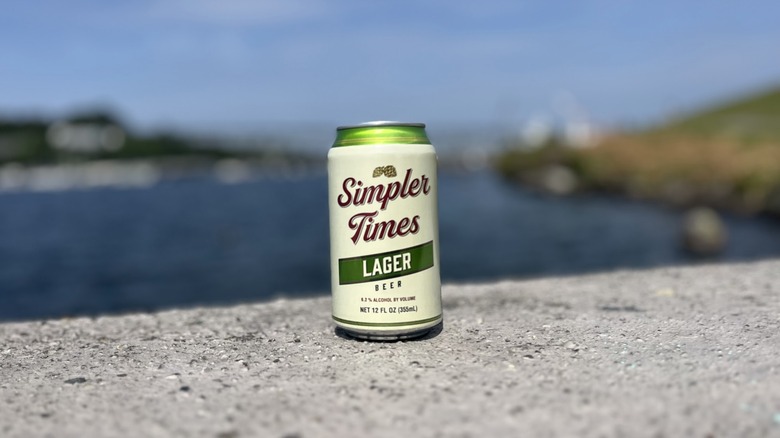 A can of Simpler Times Lager outside