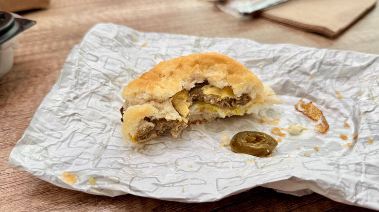 Partially eaten biscuit sandwich