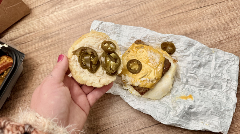 Holding open biscuit sandwich